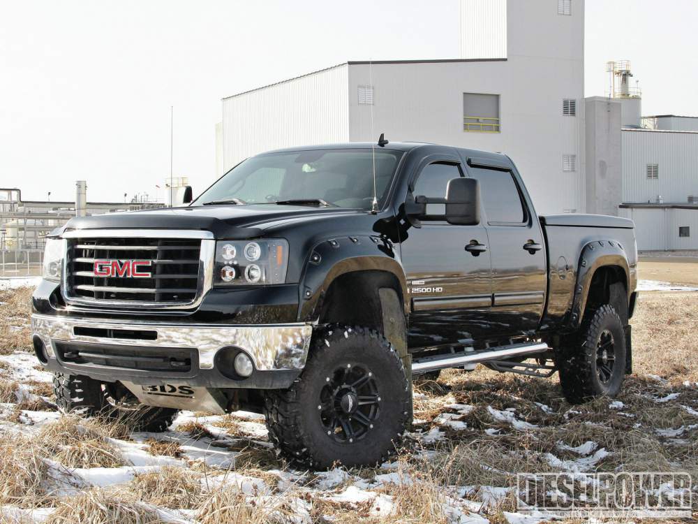 1208dp_09+fit_for_a_foreman+2008_gmc_sierrra_drivers_side_front_three_quarter.jpg