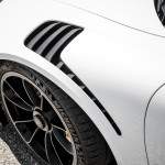 These gaping vents in the top of the front fenders allow high-pressure air to exit, and are thus a significant enabler to front downforce, which is a claimed 267 pounds at 186 mph. The fact that these unique fenders are made of carbon fiber saves five pounds versus the aluminum pieces on other 911s.