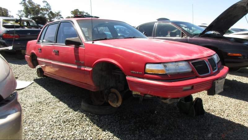 00+-+1991+Pontiac+Grand+Am+in+California+wrecking+yard+-+photo+by+Murilee+Martin.jpg