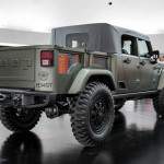 Clad in a hue of military-inspired “Tactical Green” from stem to stern, the Crew Chief 715 concept sports a five-foot cargo bed aft of the rear seats. Far from just a cosmetic homage, the Jeep Crew Chief includes steel front and rear bumpers, 20-inch beadlock wheels wearing 40-inch NDT (non-directional tread) tires, and Dana 60 front and rear axles with a four-inch lift kit and Jeep Performance Parts/Fox 2.0 remote-reservoir shocks. Jeep Performance Parts chipped in with a set of off-road rock rails, and a pair of winches—one front, one rear—guarantee the 715 will be popular on the more difficult trails. Adding to the Crew Chief’s arsenal of hardware is an onboard air-compressor system with a quick-disconnect fitting that makes airing up the 715 or any nearby vehicles a cinch. READ MORE ››