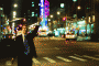 Man trying to hail a taxi (via Flickr user Linh Nguyen)