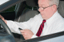 Older driver with phone