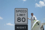 Texas legislator Pete Gallego (D-Alpine) unveils an 80 mph speed limit sign