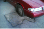 Volvo on pothole - flickr user comedy_nose